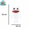 Mimic plush toy with a wide red toothy grin on a shelf
