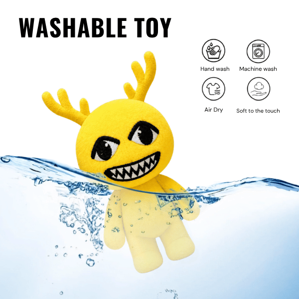 Yellow Antlered Anomaly plush with small antlers and a grin